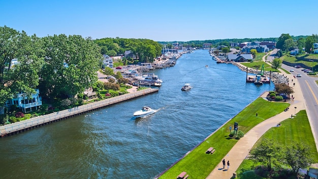 Image of Water river canal with boats and row of boats in dock