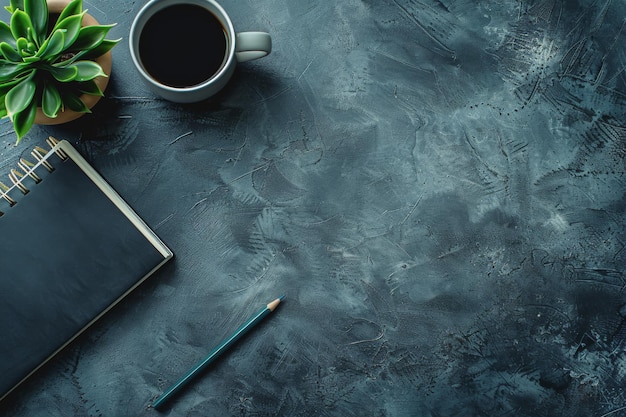 Image of a wooden work desk with a coffee mug pencils notebook and plenty of space for work