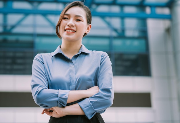 Image of young Asian businesswoman outside