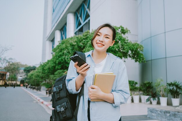 Image of young Asian college girl at school