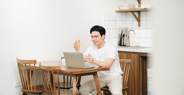 Image of young Asian man at home