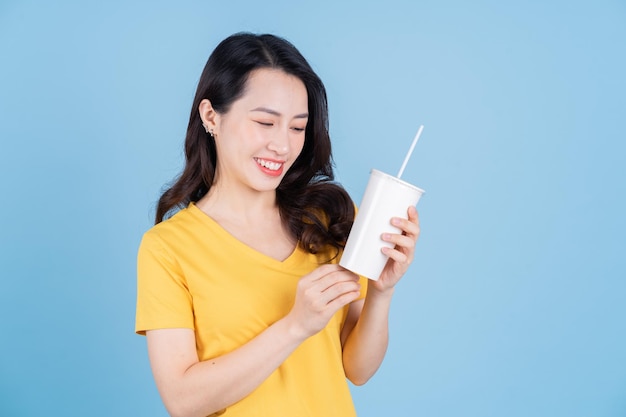 Image of young Asian woman holding a cup of bubble tea