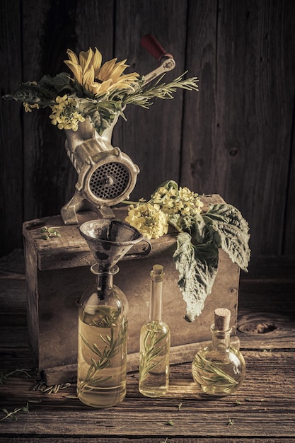 Imaginary and antique virgin oil machine with seeds and sunflower