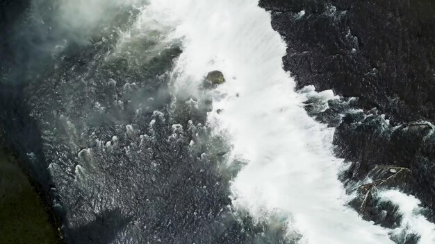 Immerse yourself in the breathtaking beauty of this stunning waterfall nature photo