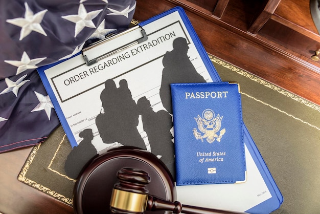 Immigration law concept Gavel passport and Silhouette of immigrants on wooden table