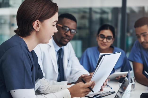 Implement those changes and we can see Shot of a group of nurses and doctors having a meeting together