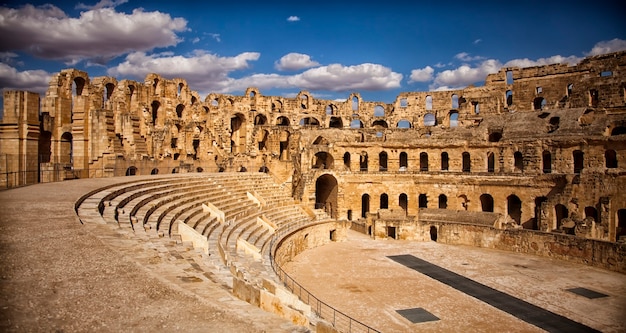 The impressive ruins of the largest colosseum in North Africa, a huge Roman amphitheater in the small village of El Jem, Tunisia. UNESCO World Heritage Site