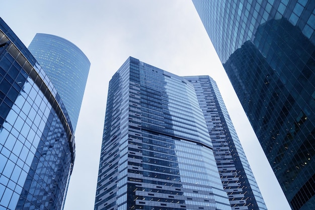 Impressive skyscrapers up to sky Blue glass building from glass modern architectural style