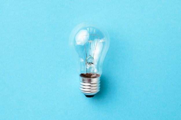 Incandescent lamp isolated on blue background