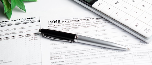 Income tax form and pen. Finance concept.