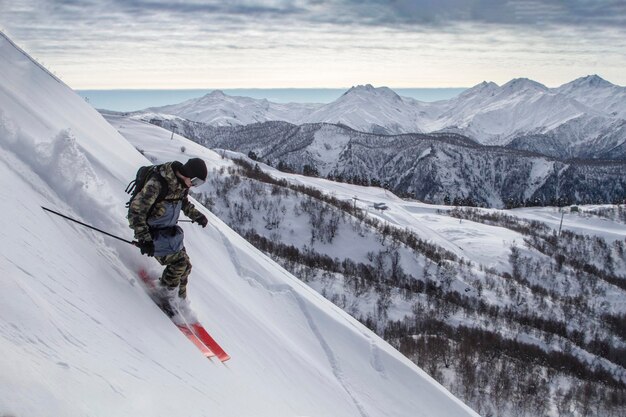 Incredible skiing in the snowy Caucasus mountains good winter day freeride in a deep snow ski season