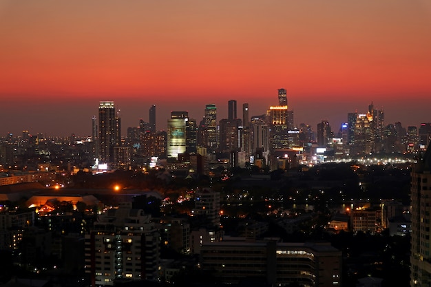 Incredible sky with sunset afterglow over skyscrapers of Bangkok downtown, Thailand