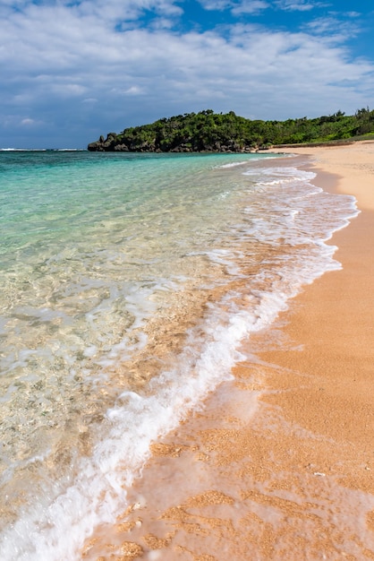 Incredible turquoise crystal clear soft wave breaking along the shore