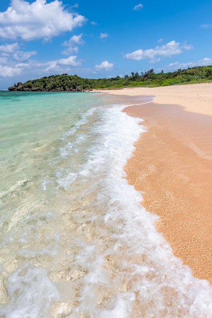 Incredible turquoise crystal clear water at seashore gentle waves breaking on sand