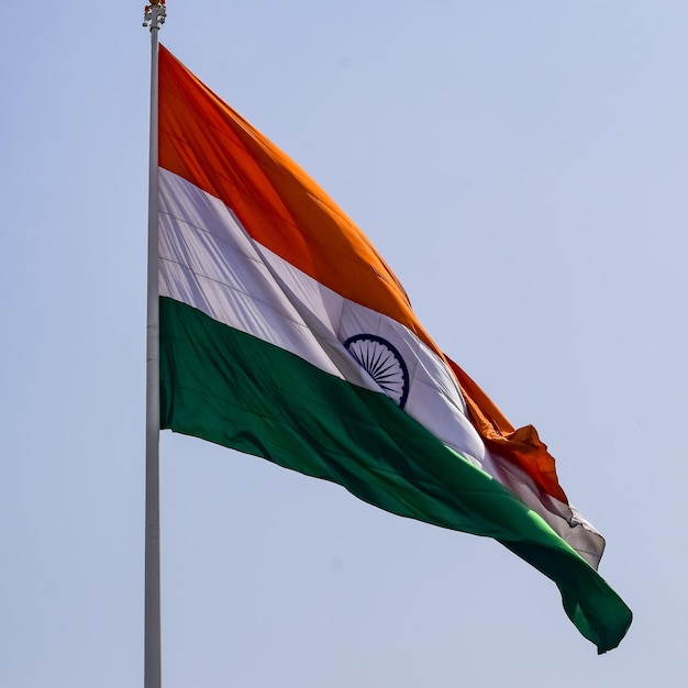 India flag flying at connaught place with pride in blue sky india flag fluttering indian flag