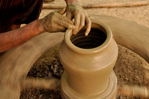 An Indian Artisan hands making clay pots