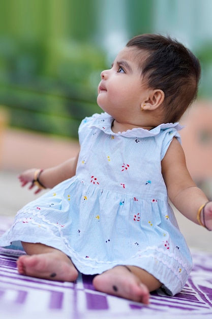 Indian baby girl child playing and giving smile