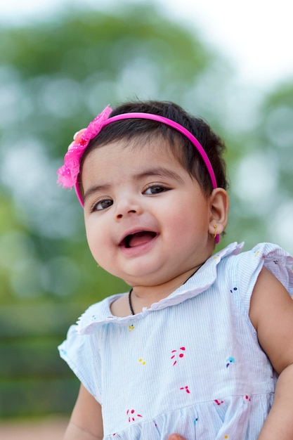 Indian baby girl child playing and giving smile