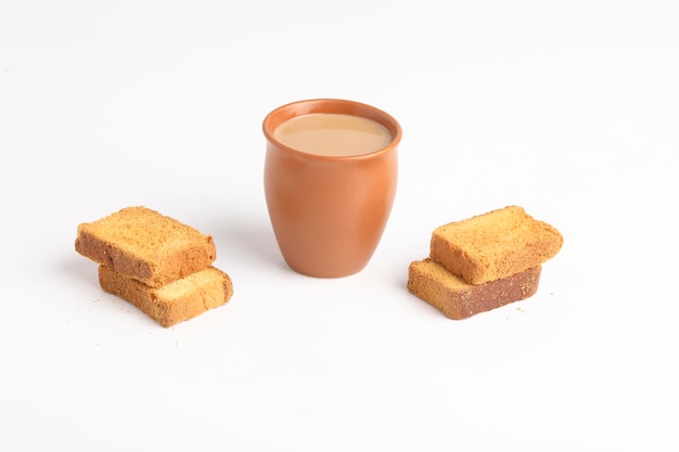 Indian breakfast. tea and rusk on white background.