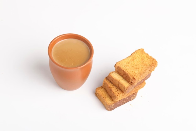 Indian breakfast. tea and rusk on white background.