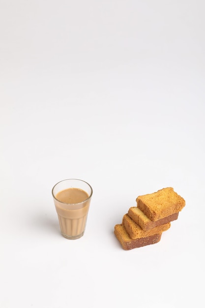 Indian breakfast. tea and rusk on white background.