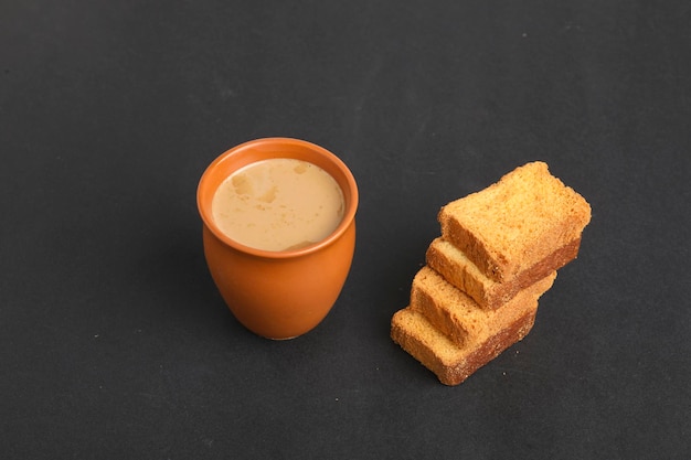 Indian breakfast. tea and rusk on white background.