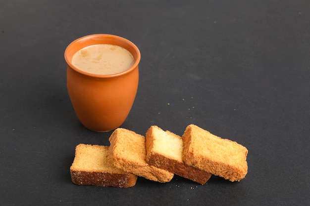 Indian breakfast. tea and rusk on white background.