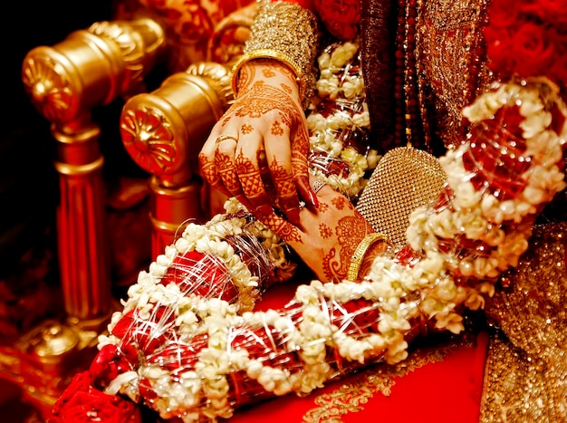 Indian bride hands in red with henna