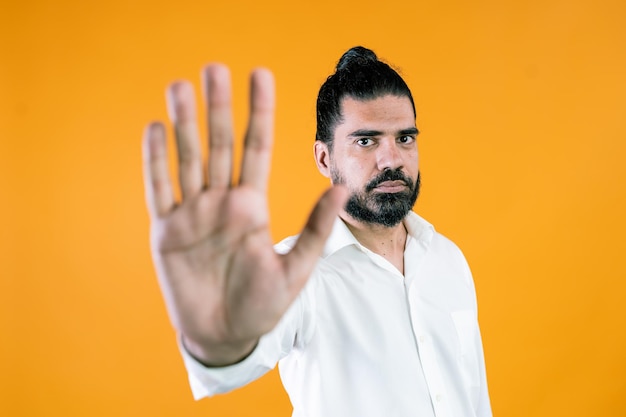 Indian businessman making stop gesture