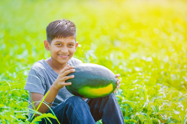 Indian child at watermelon field