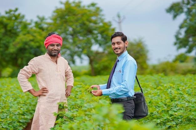 Indian farmer Discussing with agronomist at Farm and collecting some information