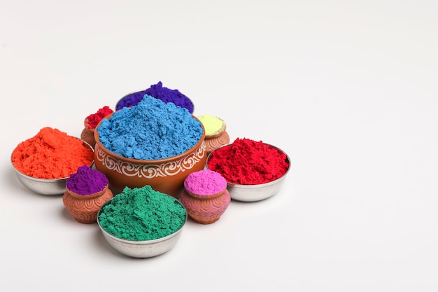 Indian festival Holi , Multi color's bowl on white background