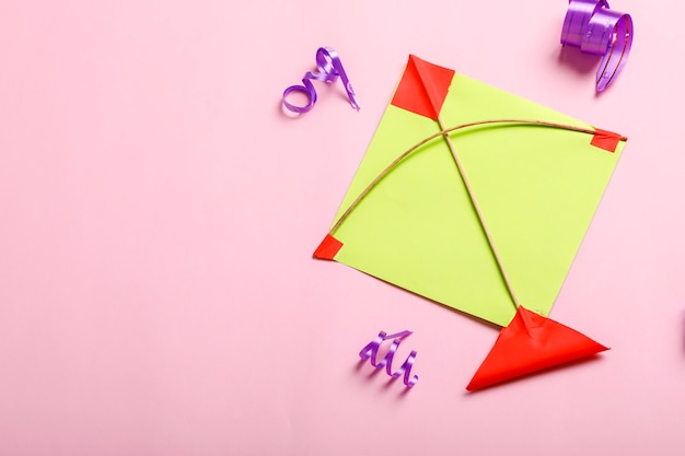 Indian festival makar sankranti concept, Colorful kite ,string and sweet sesame seed ball.