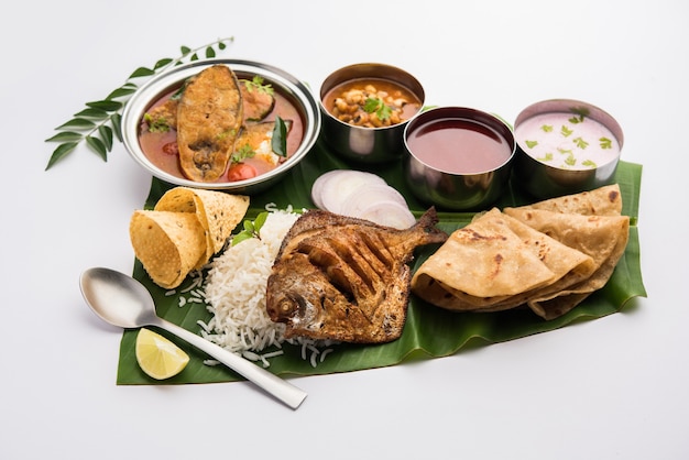 Indian Fish Platter and sauces served over banana leaf