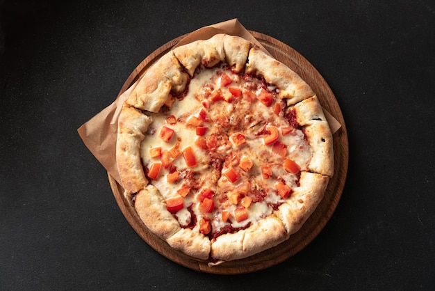 Indian flatbread pizza delivery on dark background