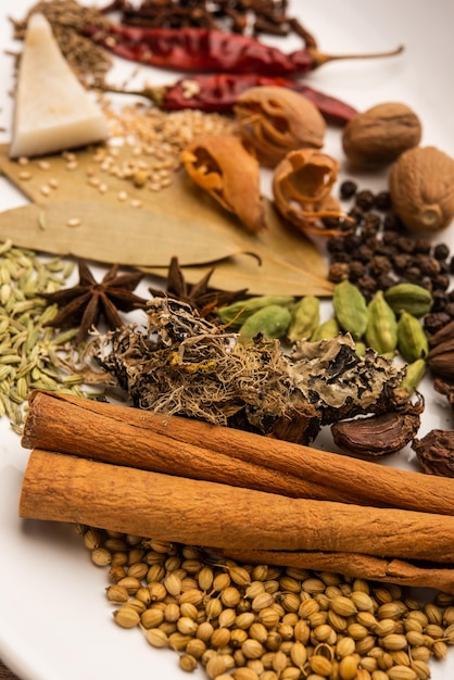 Indian Garam masala powder and colourful spices. selective focus