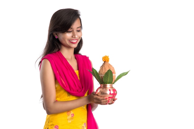 Indian girl holding a traditional copper Kalash, Indian Festival