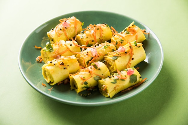 Indian gram flour snack called Khandvi or suralichya vadya, selective focus