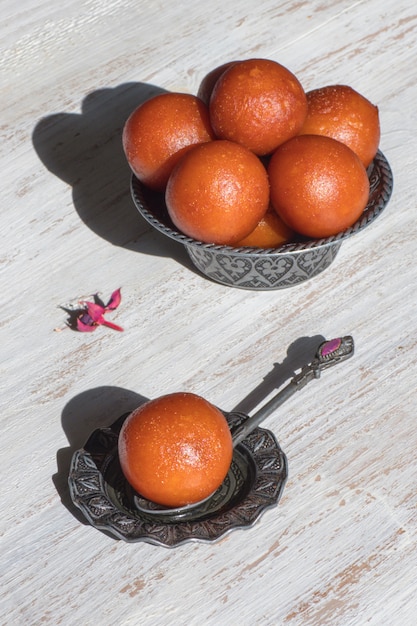 Indian Gulab Jamun dessert. Sweet served in a bowl, top view