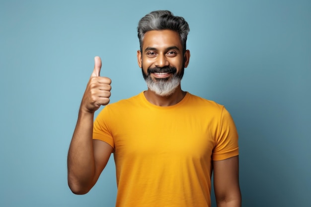 Indian handsome man showing Ok sign with thumbs up for approval