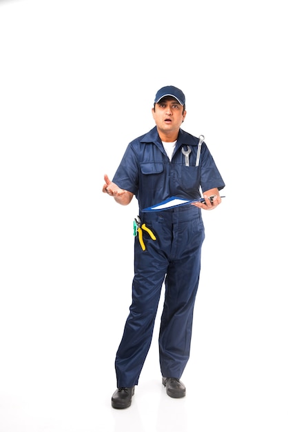 Indian happy auto mechanic in blue suit and cap