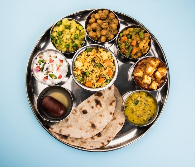 Indian or Hindu Veg Thali also known as Food platter is a complete Lunch or Dinner Meal, Closeup, selective focus