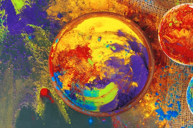 Indian Holi festival colours in small  bowls on dark background