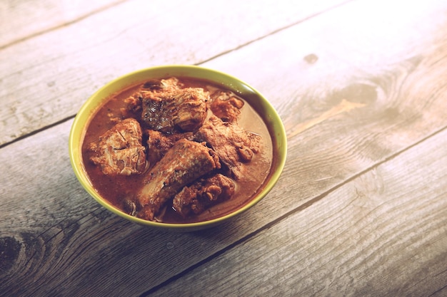 Indian home made spicey fish curry in bowl