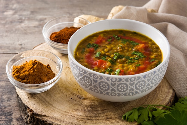 Indian lentil soup dhal in a bowl on a wooden table