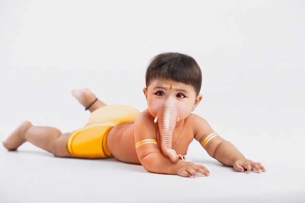 Indian little child in lord ganesha face