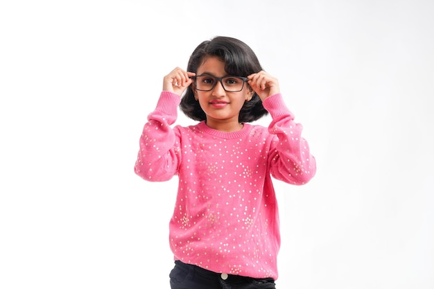 Indian little girl wearing eyeglass and giving expression