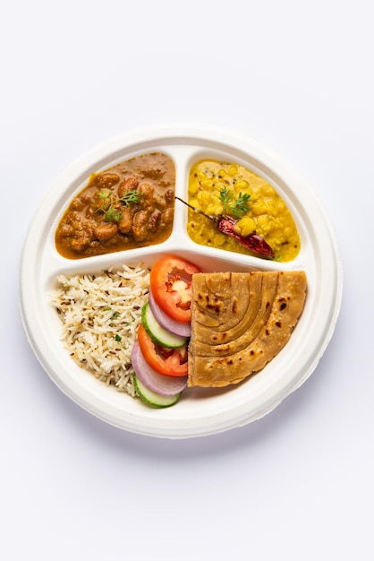 Indian mini meal parcel platter combo thali with Rajma Masala roti dal tadka jeera rice salad