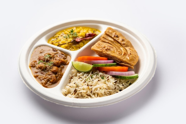 Indian mini meal parcel platter combo thali with Rajma Masala roti dal tadka jeera rice salad