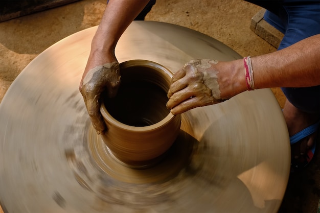 Indian potter hands at work, Shilpagram, Udaipur, Rajasthan, India